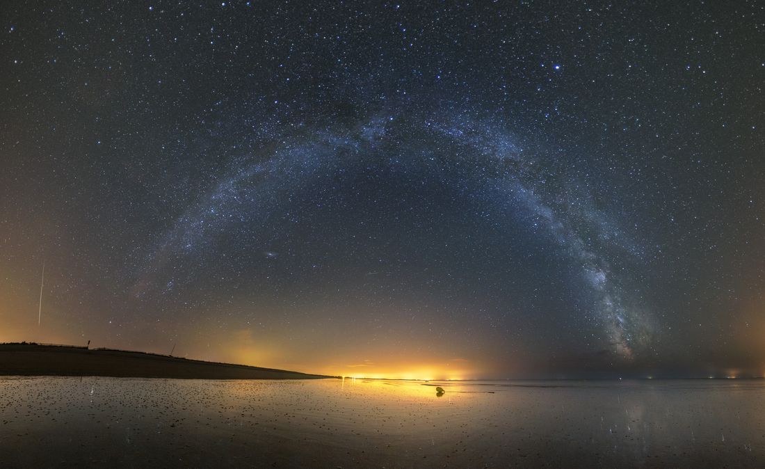 Arch of the Milky Way on a beach of Morbihan in Brittany, France.